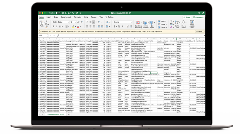 laptop showing complex spreadsheets