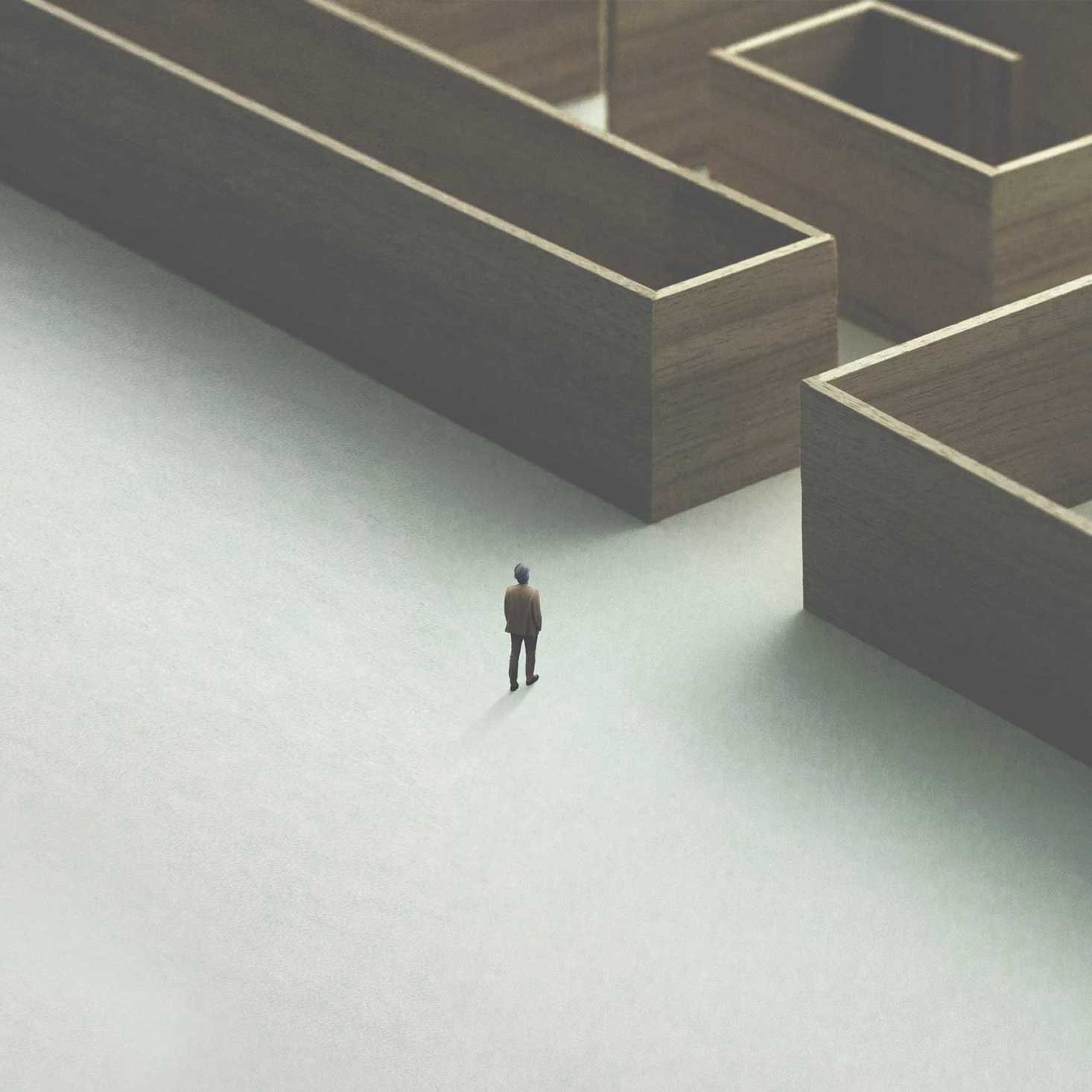 Animated man walking into a maze.