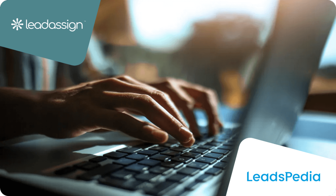 hands typing on laptop, leadassing and leadspedia logo